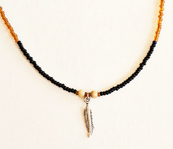 Gold and Black Necklace image 0